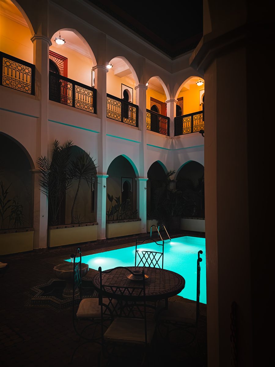 Riad courtyard and pool at night